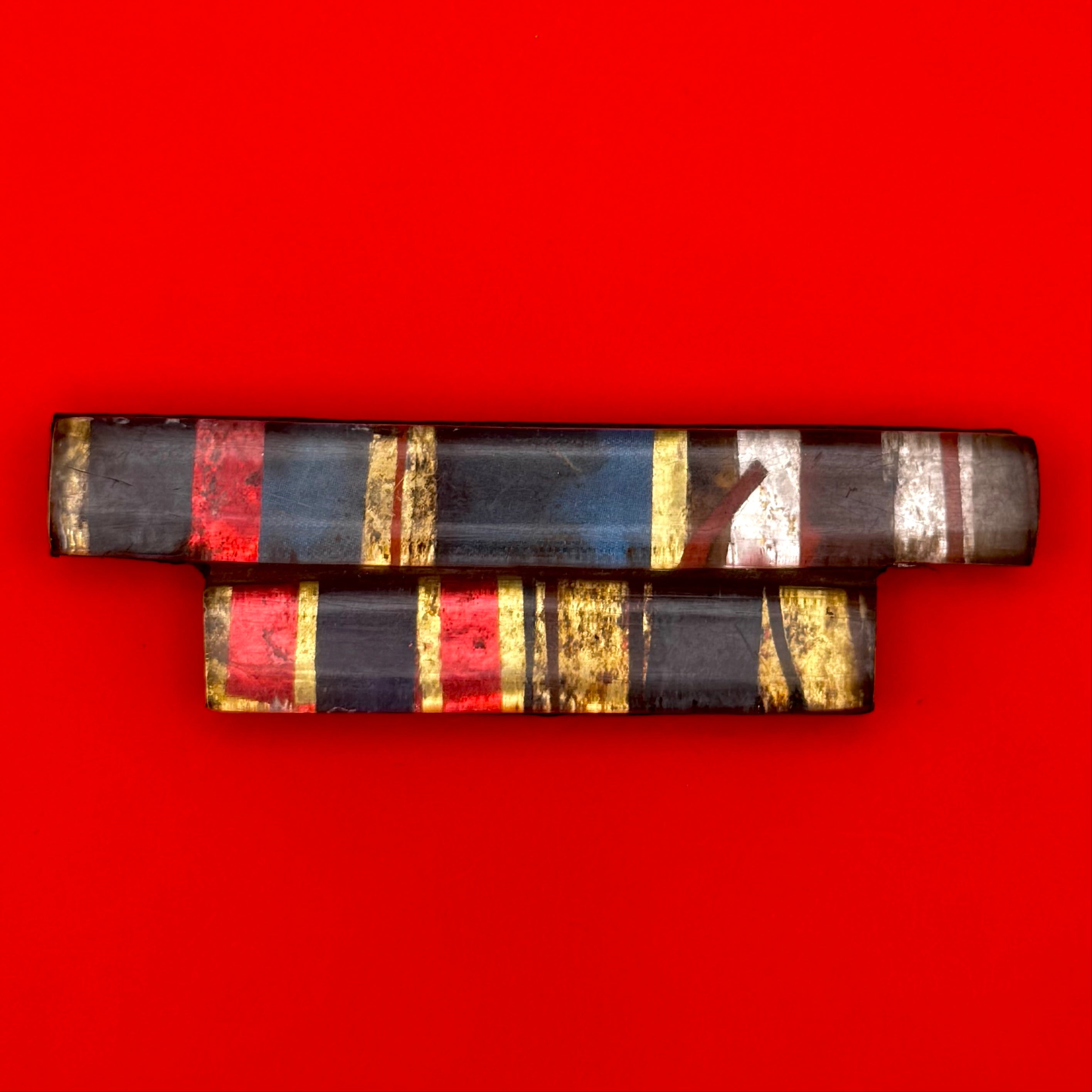 1990s Mongolian military five-piece ribbon bar with vintage metal frame, showcasing colorful Cold War and transitional era service decorations.