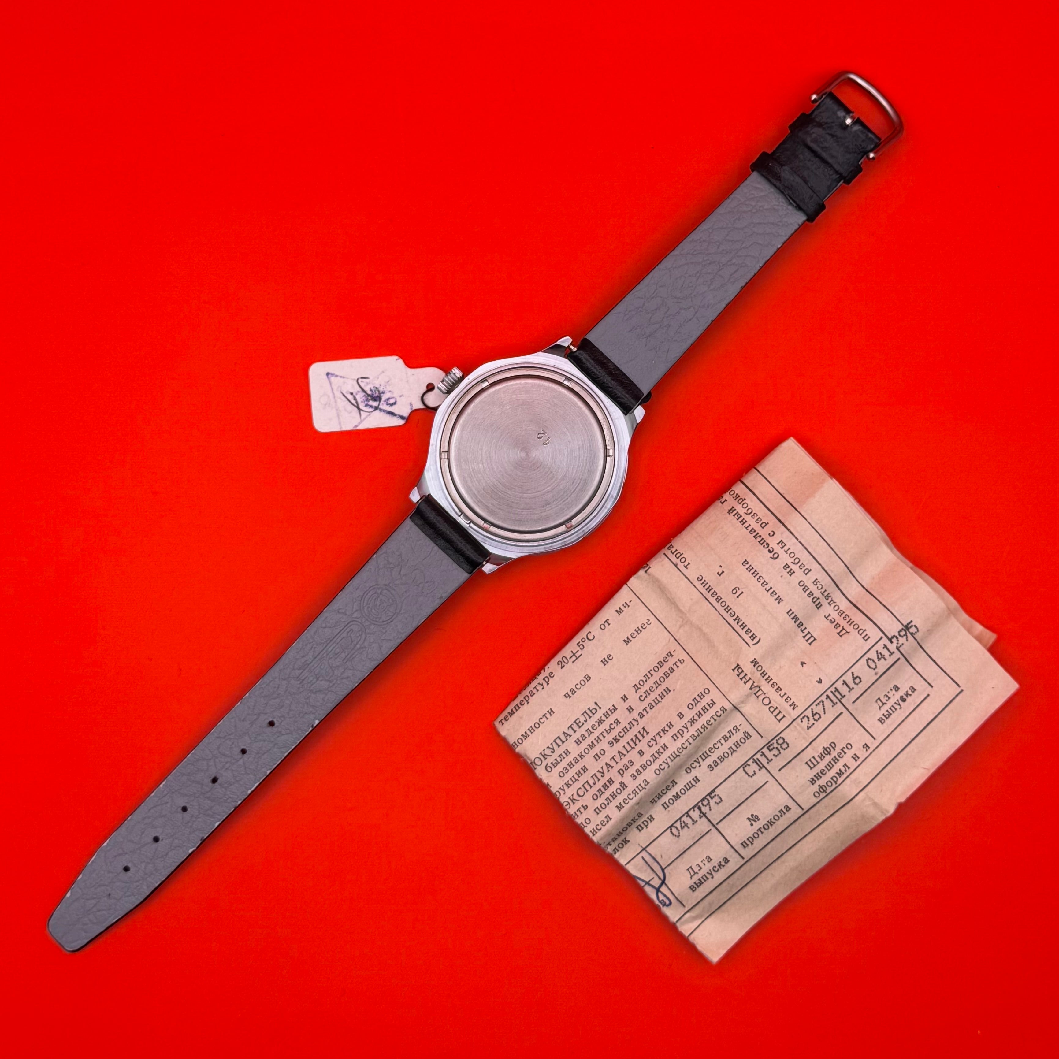 Close-up of GRU watch leather strap and engraved case back in original unused condition