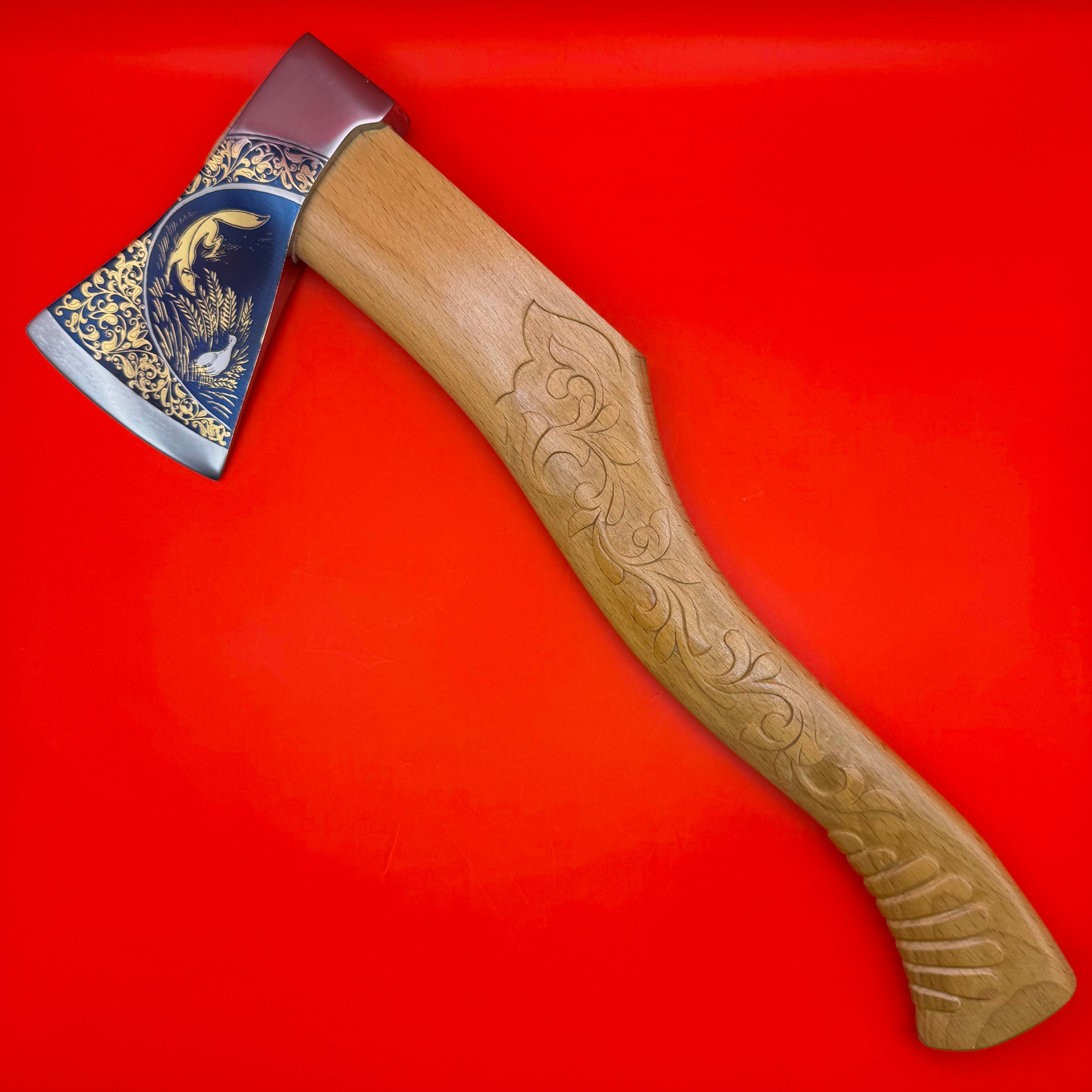 Gold-plated Russian ceremonial axe with engraved blade and carved wooden handle for elite hunting display