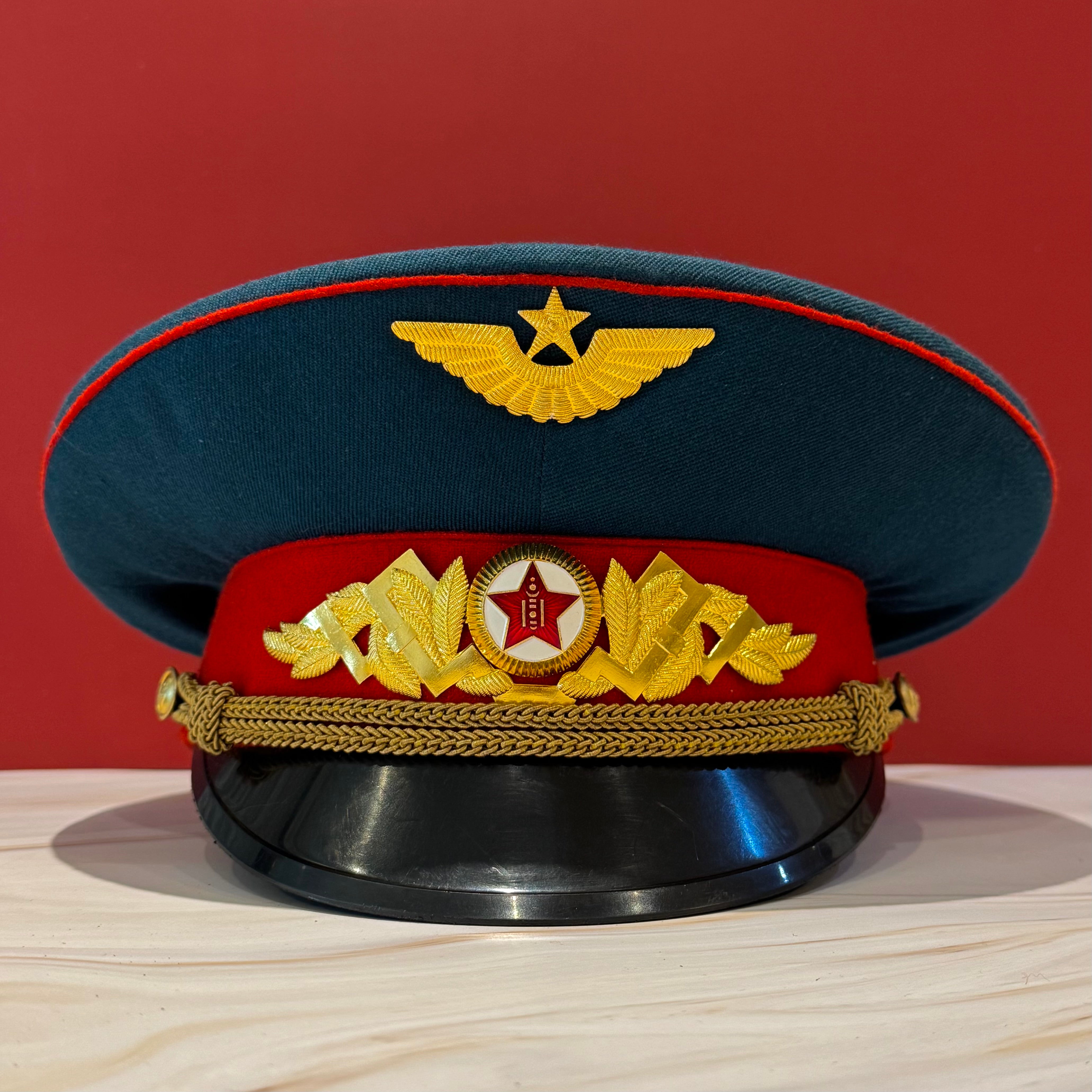 Mongolian People's Army Air Force visor cap featuring gold metal aviation badge and MPA red star insignia