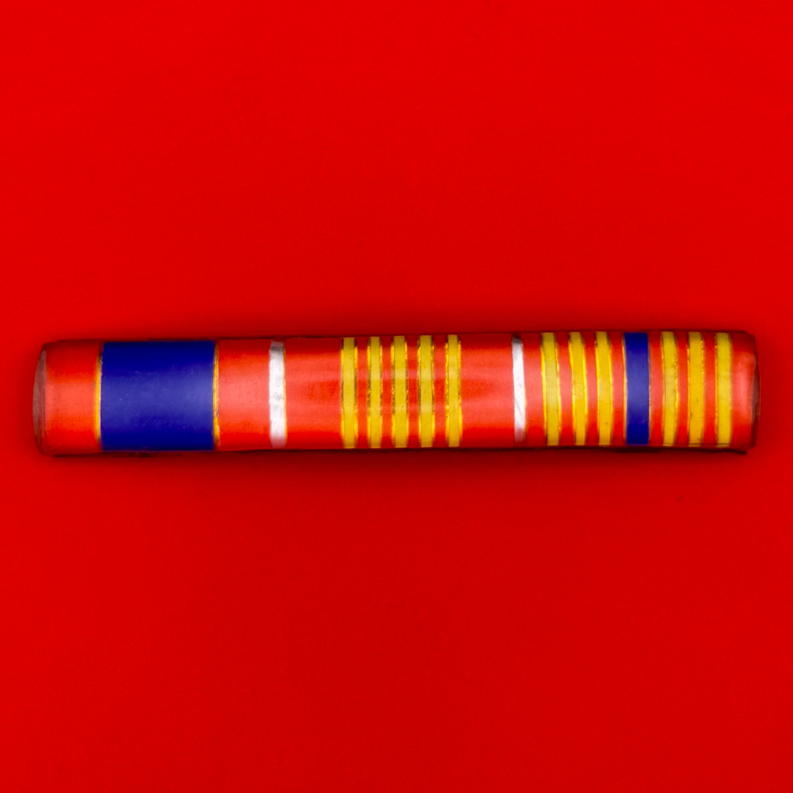 1990s Mongolian military ribbon bar in red, blue, and yellow, mounted on a vintage Cold War–era metal frame.