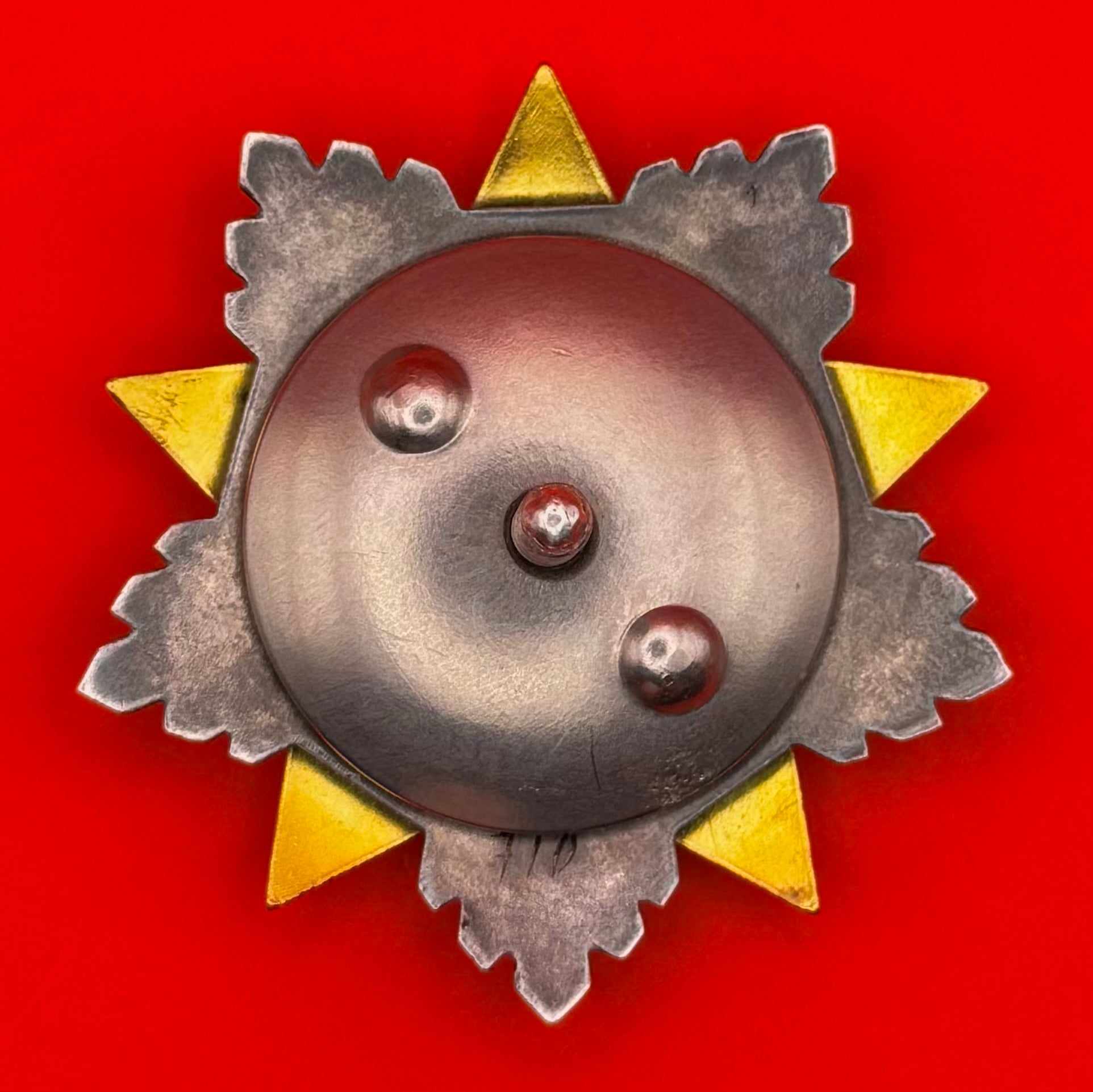 Back side of Order of Sukhbaatar Type 1 award – high-grade 23K gold with blue and red enamel rays from Cold War Mongolia