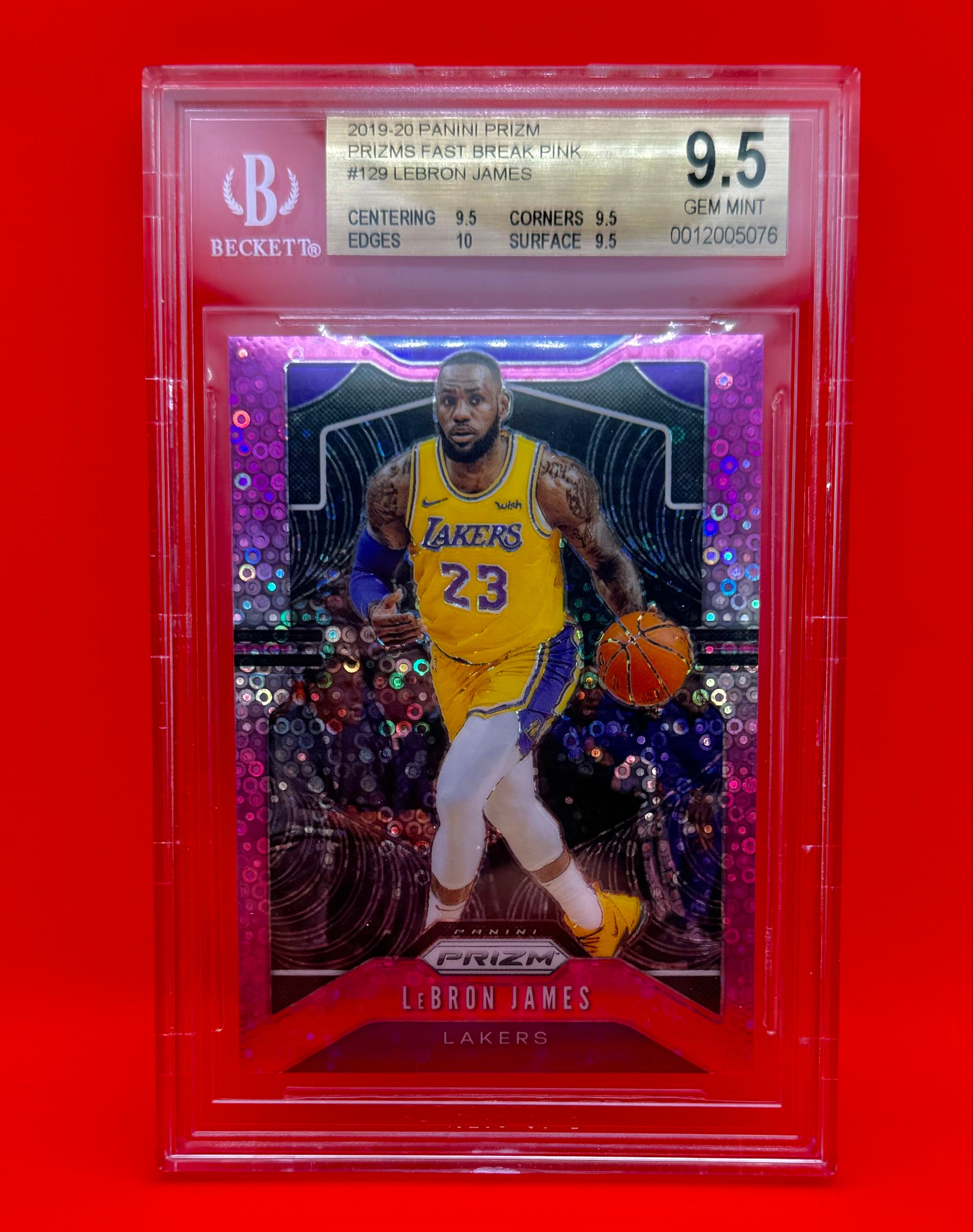 Angled photo of LeBron James Pink Prizm #23/50 card showcasing pink foil shine