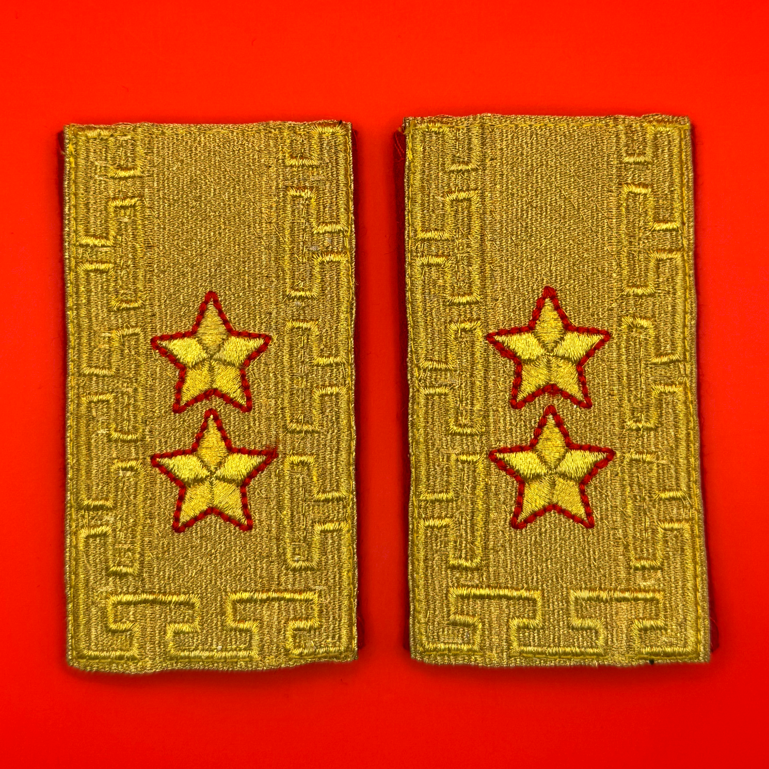 Pair of modern Mongolian Army Major General rank parade shoulder boards with gold embroidery and red stars