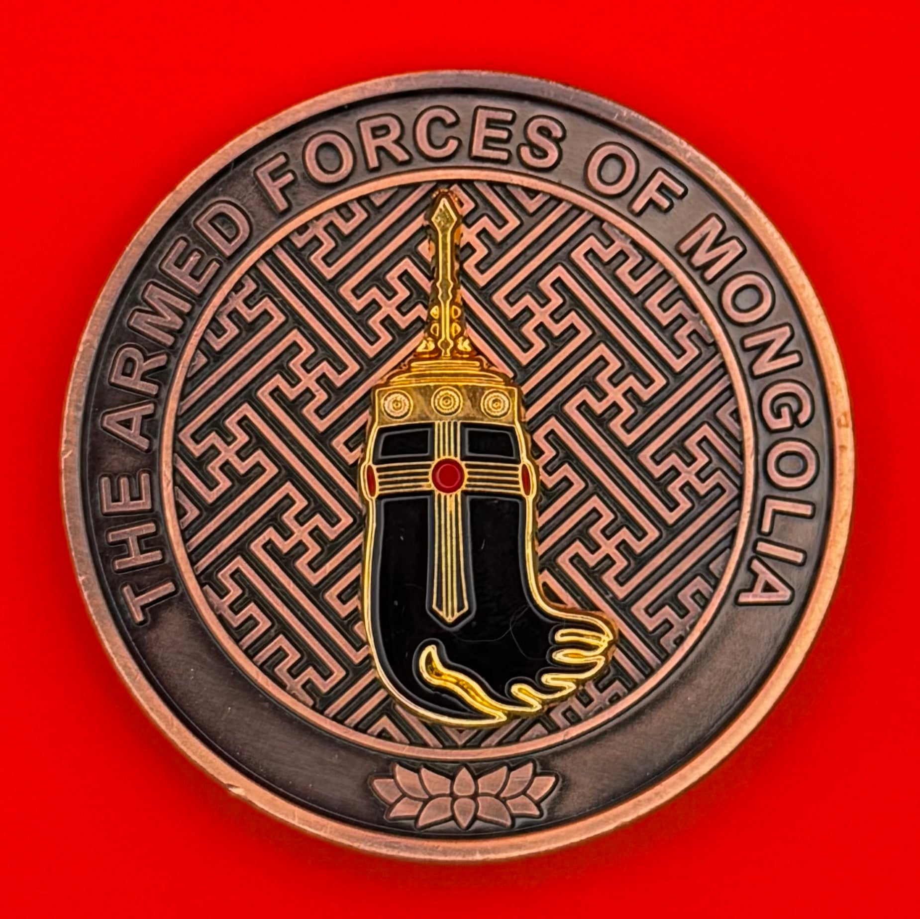 Mongolian Armed Forces challenge coin with presentation box featuring official emblem and swastika pattern background